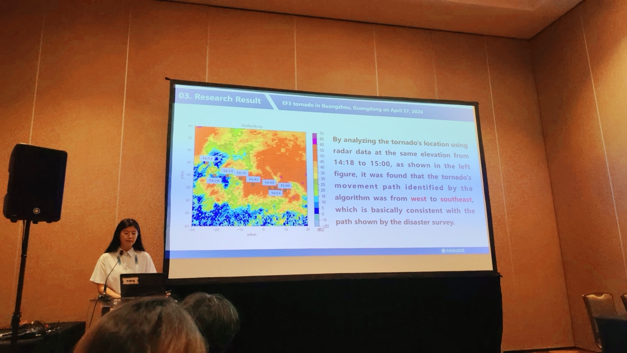 A person standing in front of a large screen AI-generated content may be incorrect.