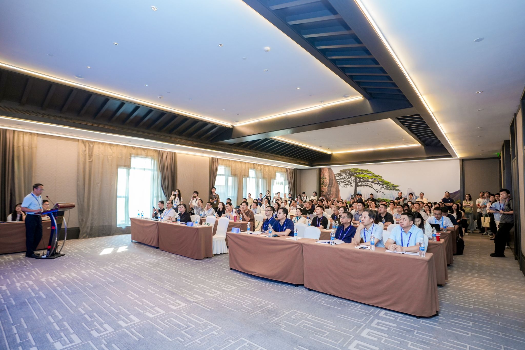 A group of people sitting in a room AI-generated content may be incorrect.